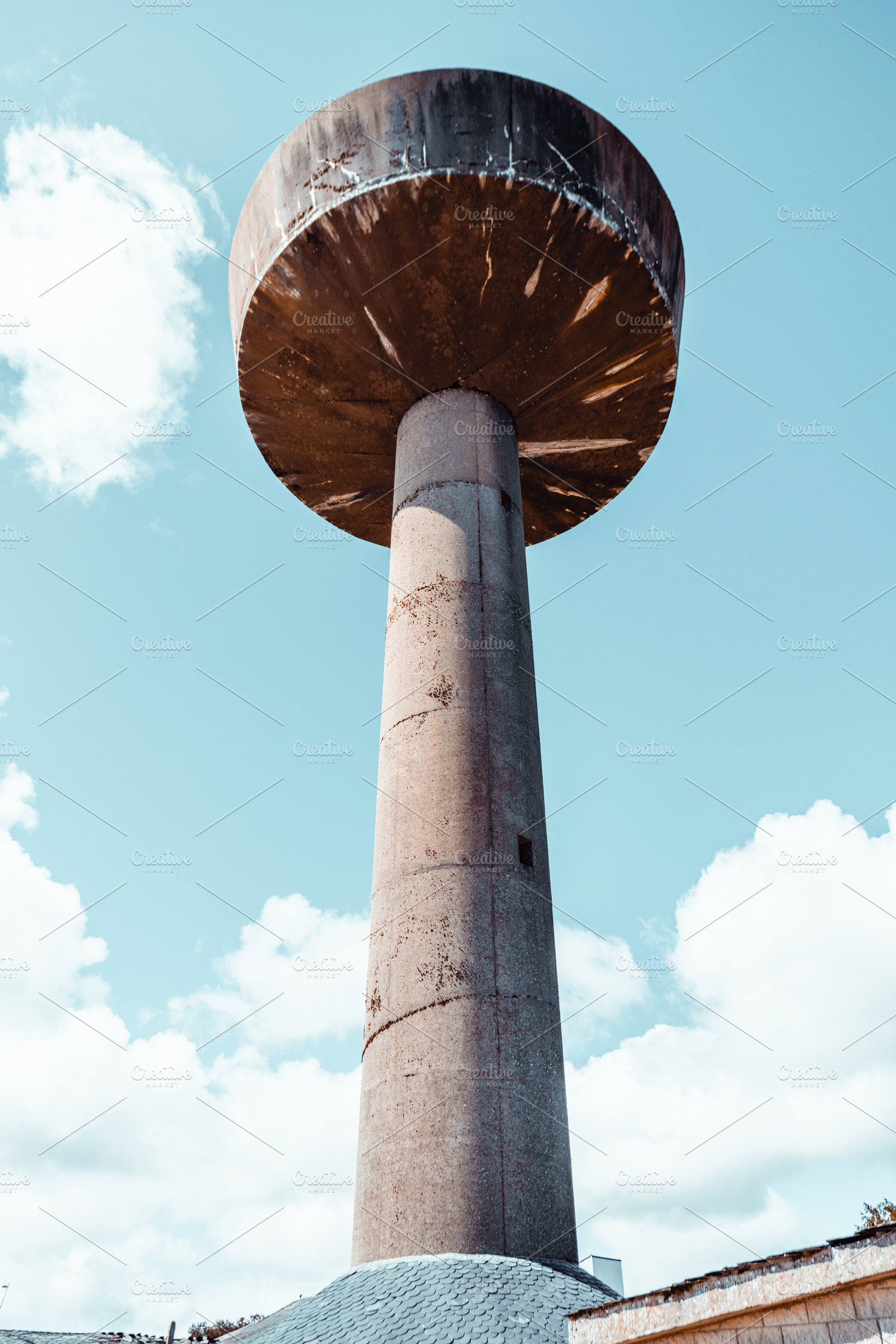 Concrete water tower against sky, an Architecture Photo by SkyNext