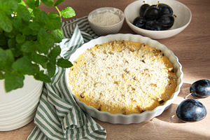 Baking plum crumble with fresh fruit and mint, a Food & Drink Photo by Olena Rudo