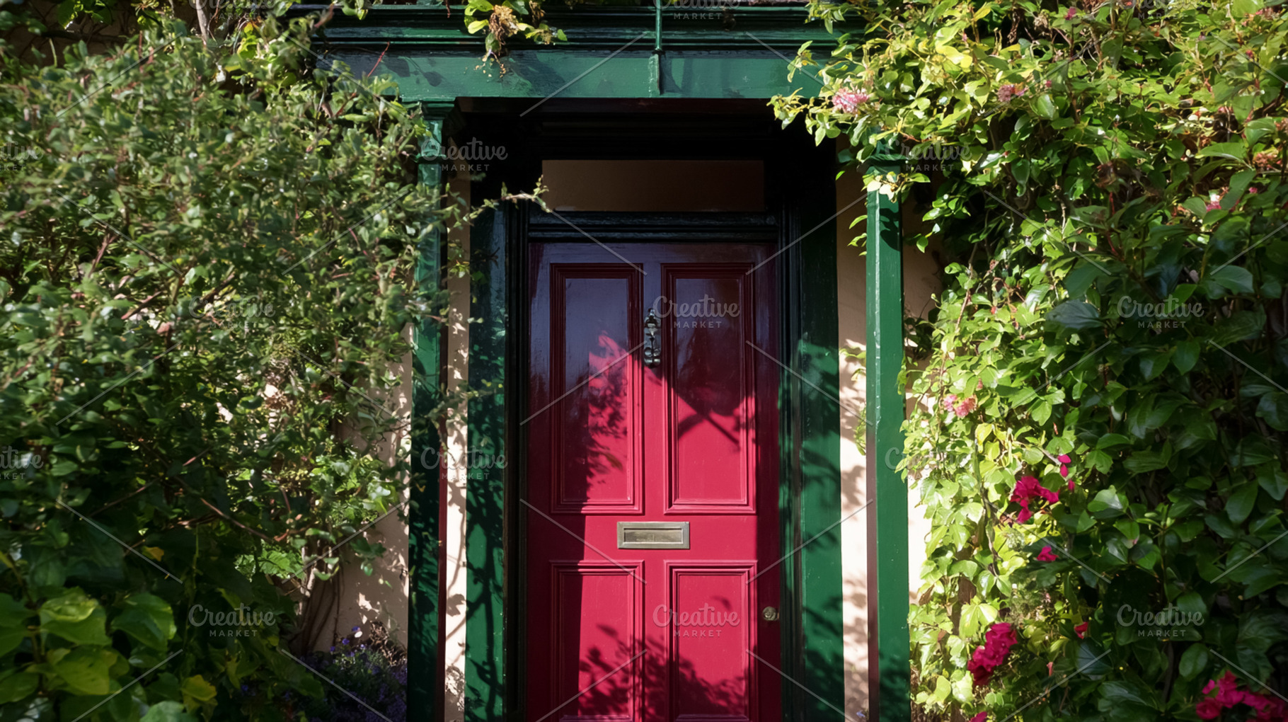 Red door with green frame creating charming house entrance, surr, a Photo by Studio ANNA