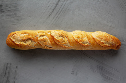 Homemade French Bread Baguette on a gray background, top view., a Food & Drink Photo by LiudmylaChuhunova