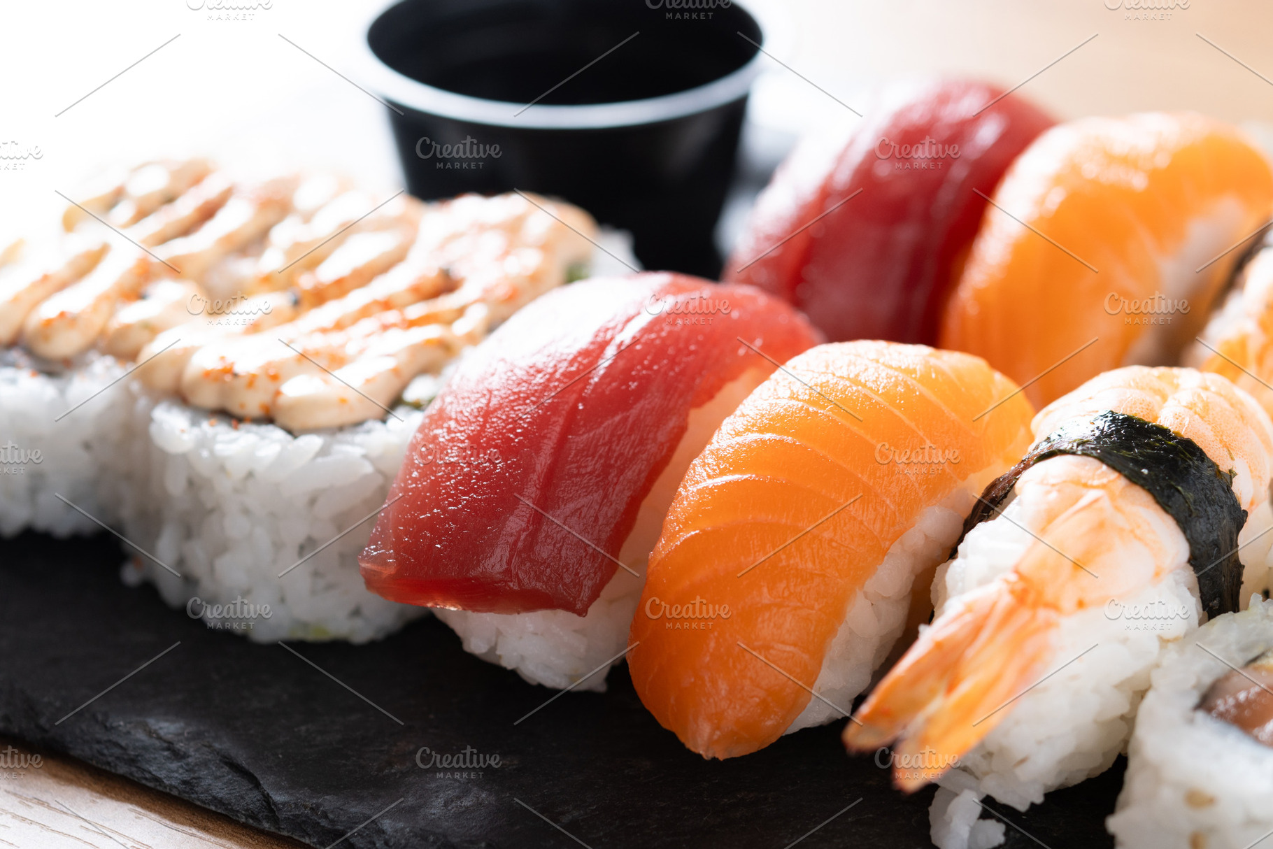 Assorted sushi platter with salmon, tuna, shrimp and rolls, a Food & Drink Photo by etorres69