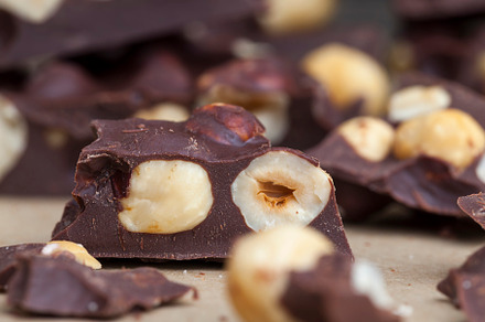 Pieces of homemade milk chocolate with lots of hazelnuts, a Photo by MyPhotos
