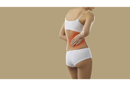 Woman suffering from lower back pain, a Person Photo by StudioRomantic