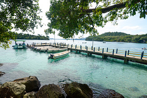 Pier and Boats in Sabang Waters, a Nature Photo by bastera