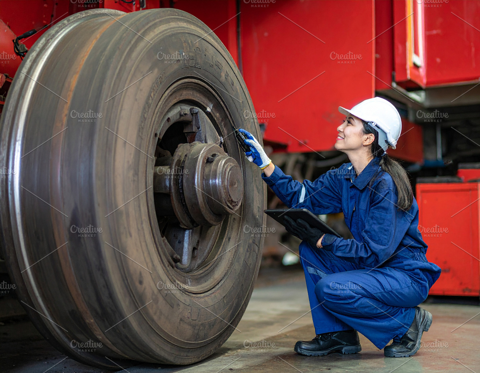 Airplane mechanics checking a airplane wheel, an Industrial Photo by DanFLCreativo