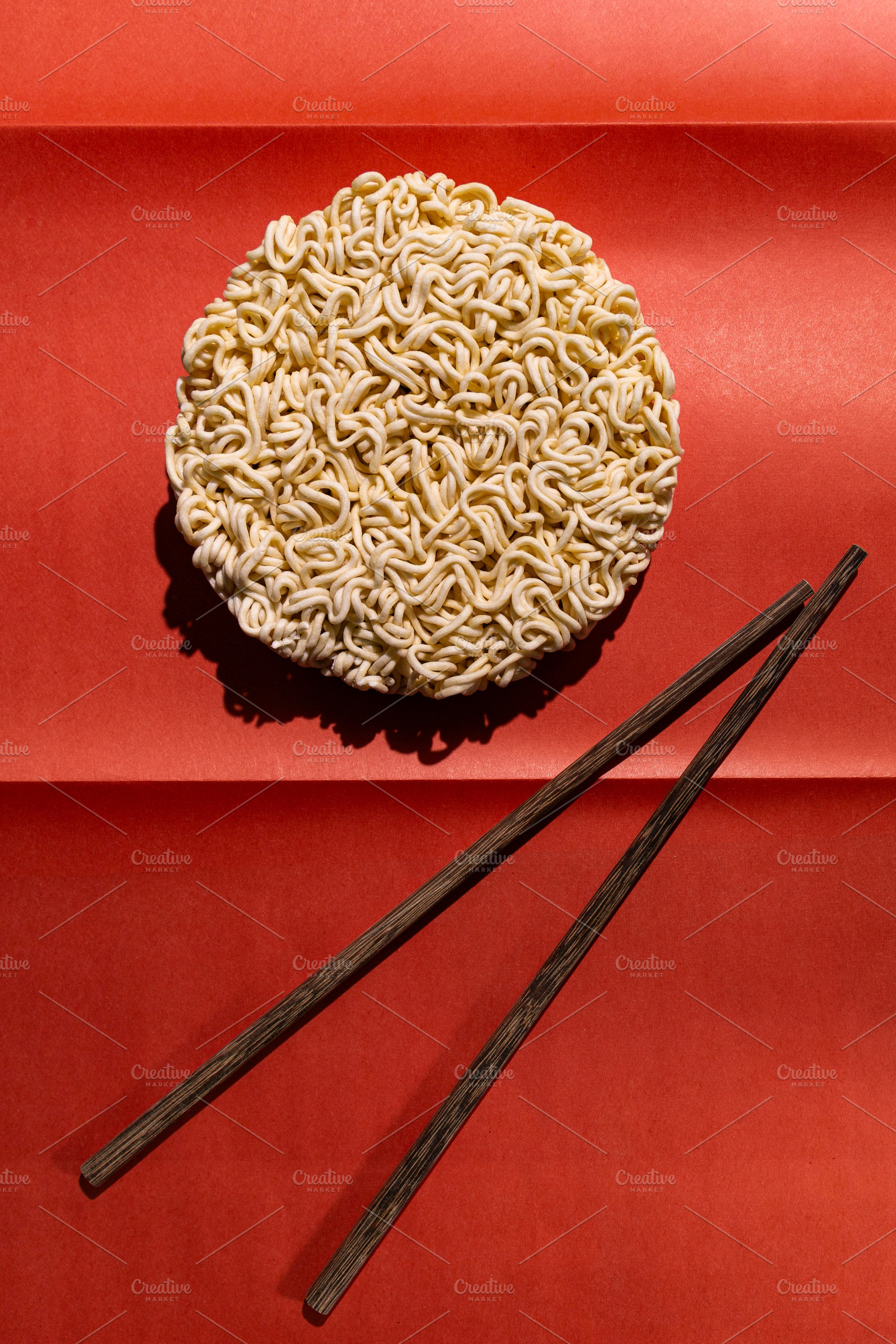 Round block of instant noodles, a Food & Drink Photo by Edalin's Store