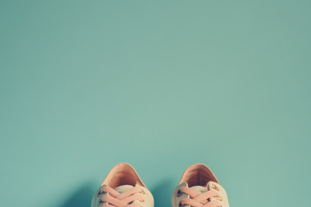 Pink sneakers on color background, a Photo by Dvoevnore photos