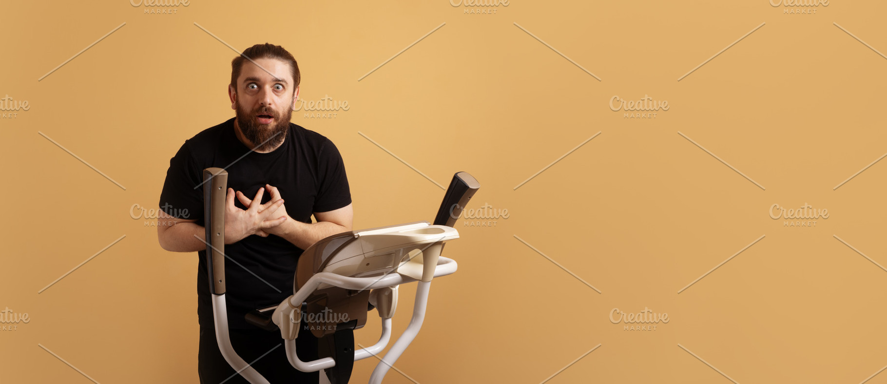 Shocked man in black shirt holding chest while standing on ellip, a Person Photo by Ales Munt