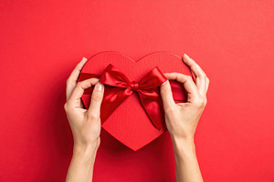 Hands Holding Heart Shaped Gift Box, a Holiday Photo by Davizro's Market