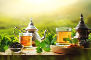 Glass cups with tea and metal teapots in nature, a Food & Drink Photo by Davizro's Market