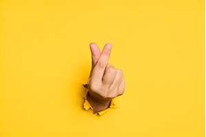 Love finger gesture through hole in, a Background Photo by Gladkov photography