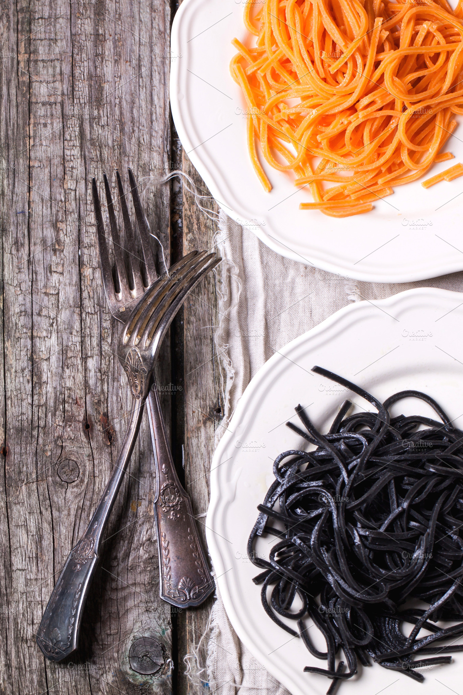 Black and orange spaghetti featuring pasta, italian, and food