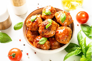 Meatballs in tomato sauce on white, a Food & Drink Photo by Nadia-nb