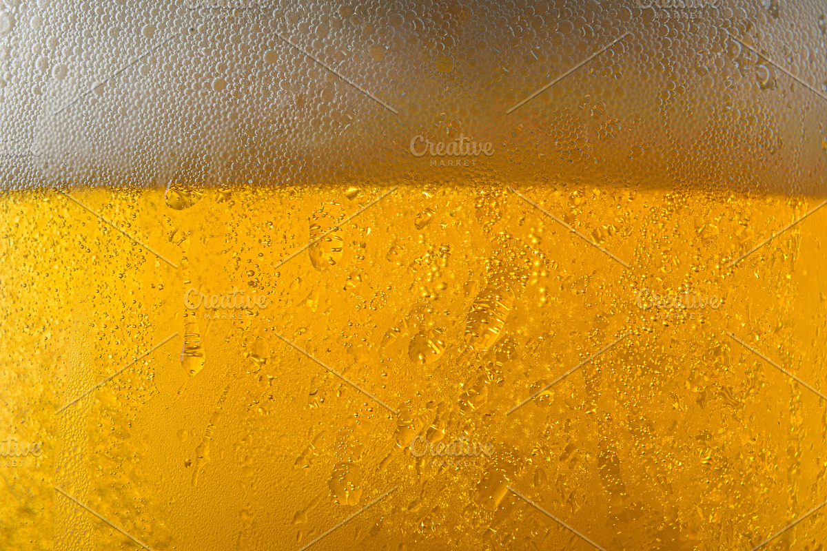 Macro of beer surface and foam in glass with drops, a Food & Drink Photo by Davizro's Market (Photo 1 of 2)