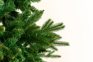 Bare synthetic Christmas tree branches creating background, a Holiday Photo by Antonio Gravante Market