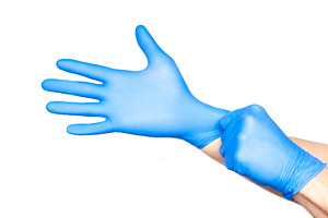 Doctor putting on gloves isolated on containing background, blue, and care