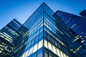 Illuminated skyscraper facade at dusk, isolated against a deep b, an Architecture Photo by DanFLCreativo
