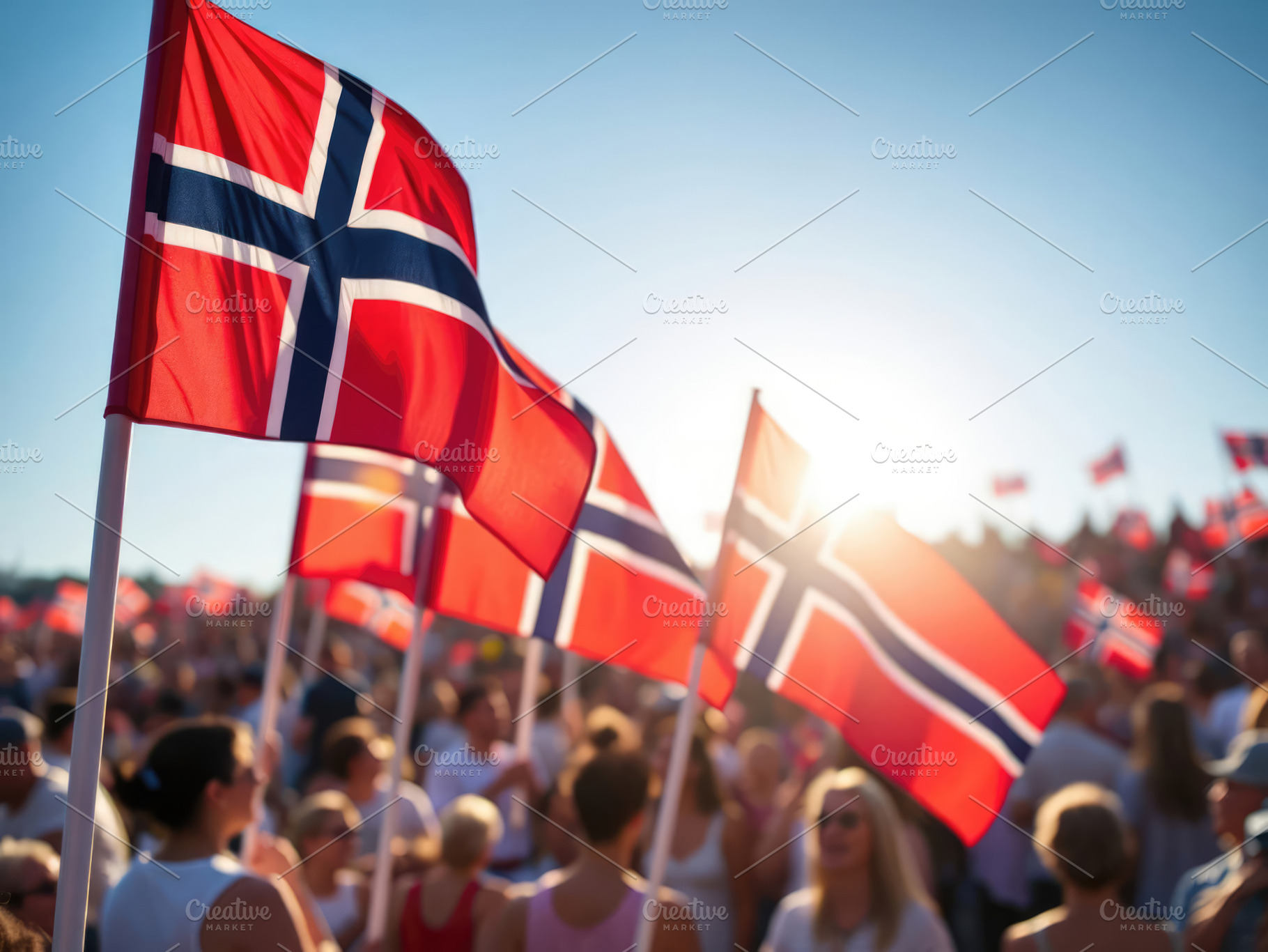 Crowd celebrating Norwegian National Day, waving vibrant flags under a bright s, a Holiday Photo by Antonio Gravante Market