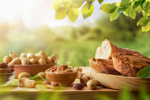 Peanut butter snacks and fruits in a cultivated field, a Food & Drink Photo by Davizro's Market