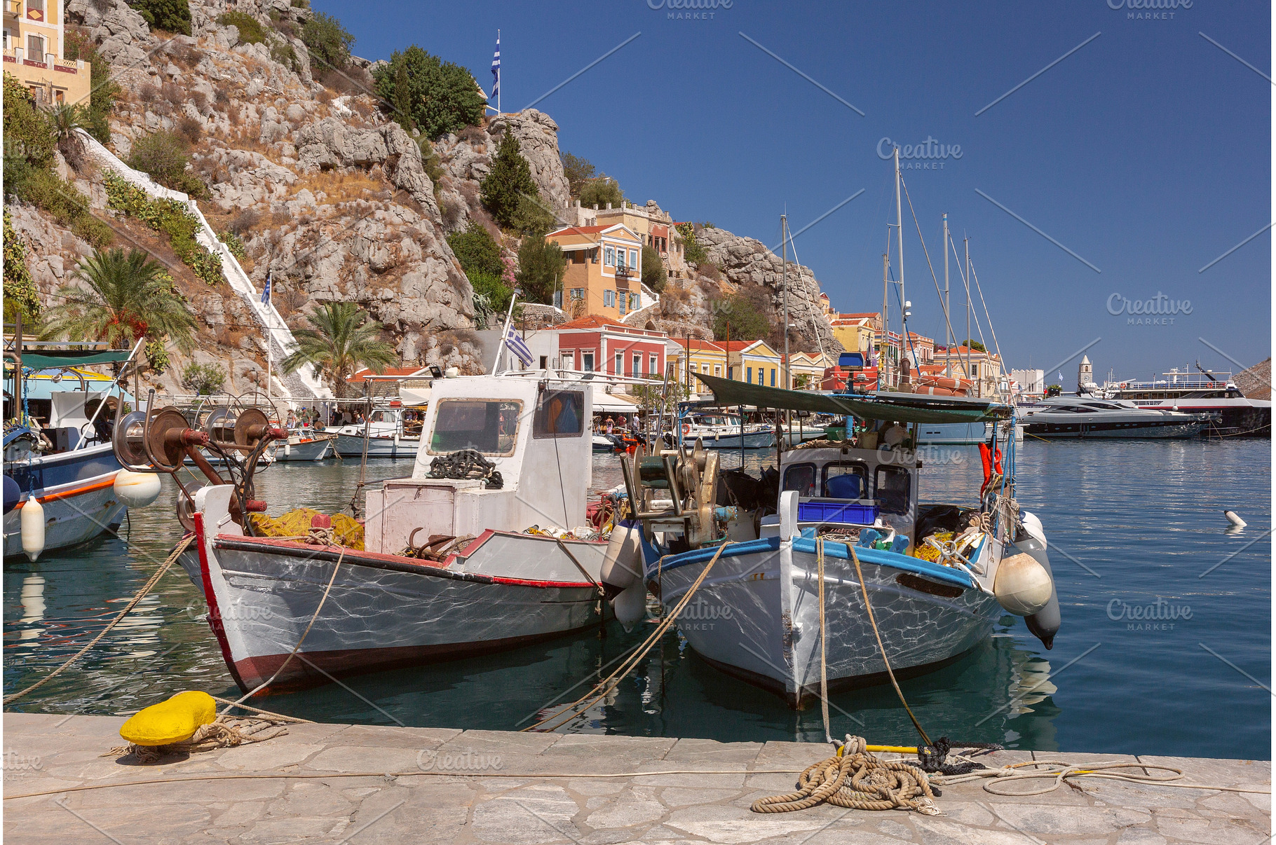 Fishing boats moored in Symi harbor, an Architecture Photo by kavalenkava