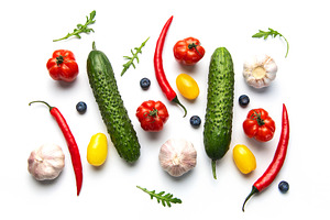 Colorful fresh vegetables and berries on white background, a Food & Drink Photo by Olena Rudo