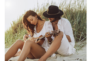 Couple in Love Playing Guitar and