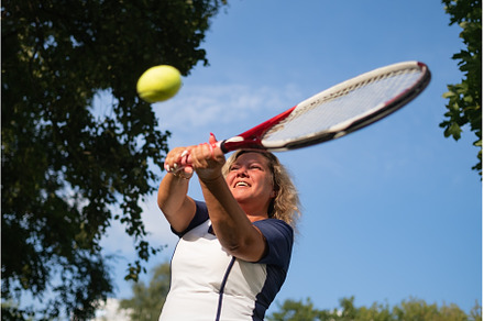 mature woman playing tennis serving, a Sports & Recreation Photo by Koldunov