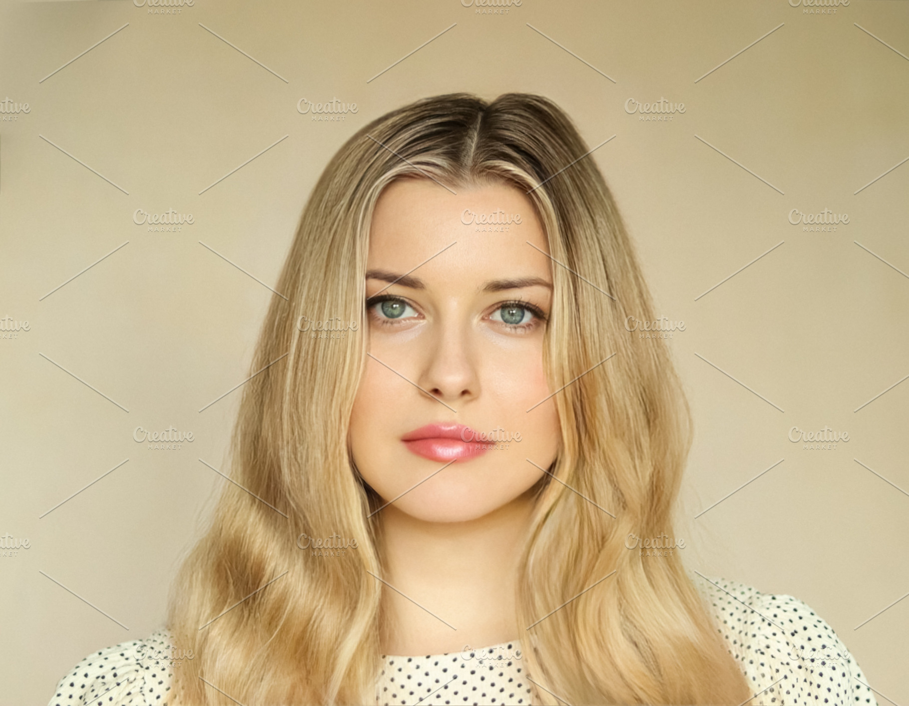 Woman portrait with blonde wavy hair, blue eyes and natural make, a Person Photo by Studio ANNA