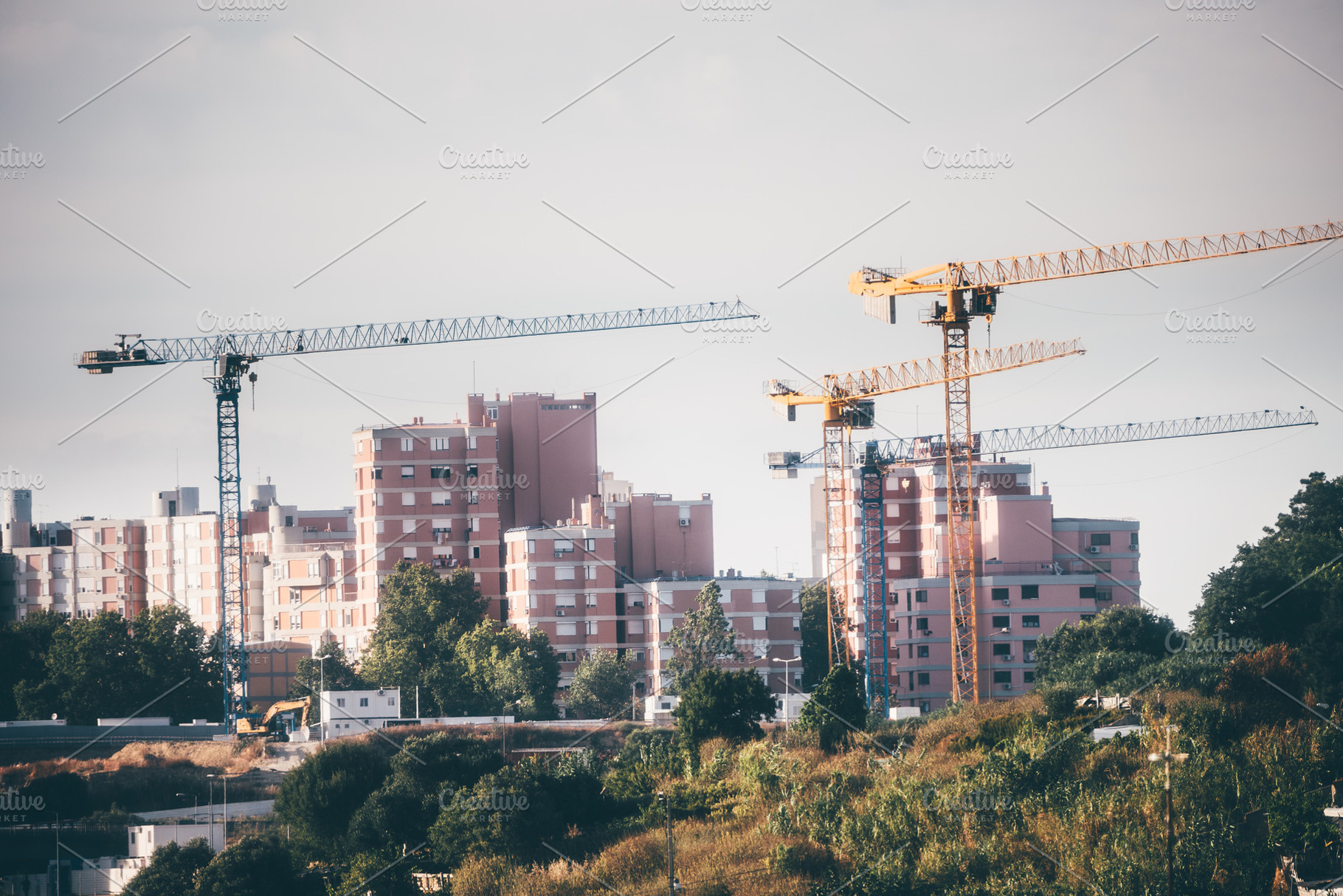 Tower Cranes Around Housing Blocks, an Architecture Photo by SkyNext