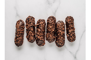 Healthy chocolate eclairs on marble, a Food & Drink Photo by Fascinadora
