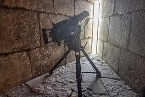 Stone corridor with cannon and narrow light slit, an Architecture Photo by DanFLCreativo