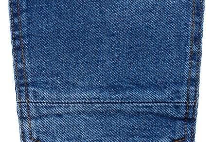 Back pocket of blue jeans with button isolated on white backgrou, a Beauty & Fashion Photo by ndanko