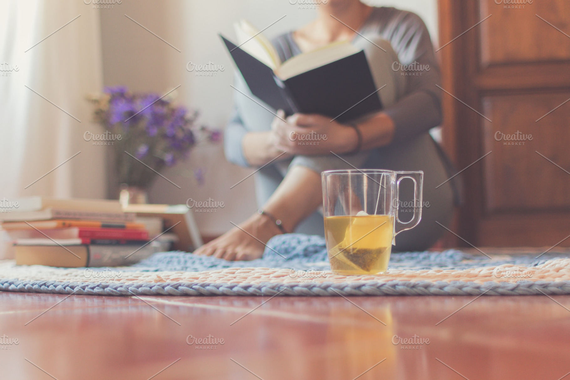 Tea and reading, a Person Photo by Tan Tranquila