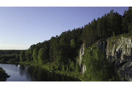 A Serene River Flowing Through a, a Nature Photo by Media Whale Stock