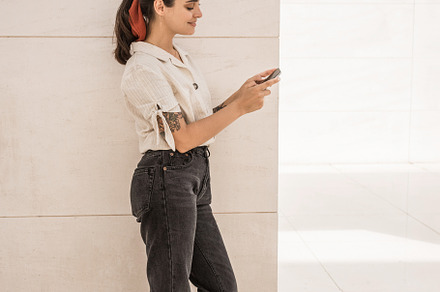 Girl using her smartphone featuring woman, girl, and background, a Person Photo by Julia Brenner
