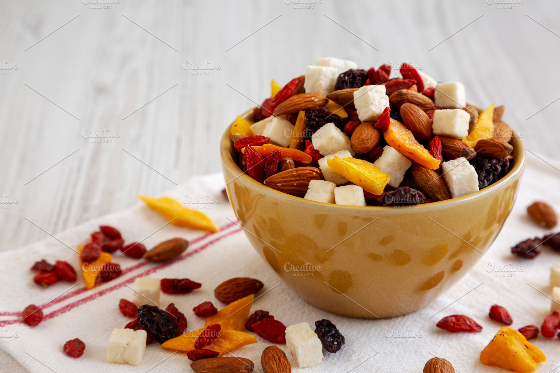 Healthy Dried Fruit and Nut Mix in a Bowl, side view. Close-up., a Food & Drink Photo by LiudmylaChuhunova