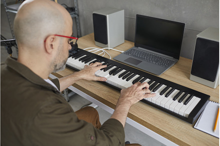 Man who loves to play music plays on, a Person Photo by StudioRomantic