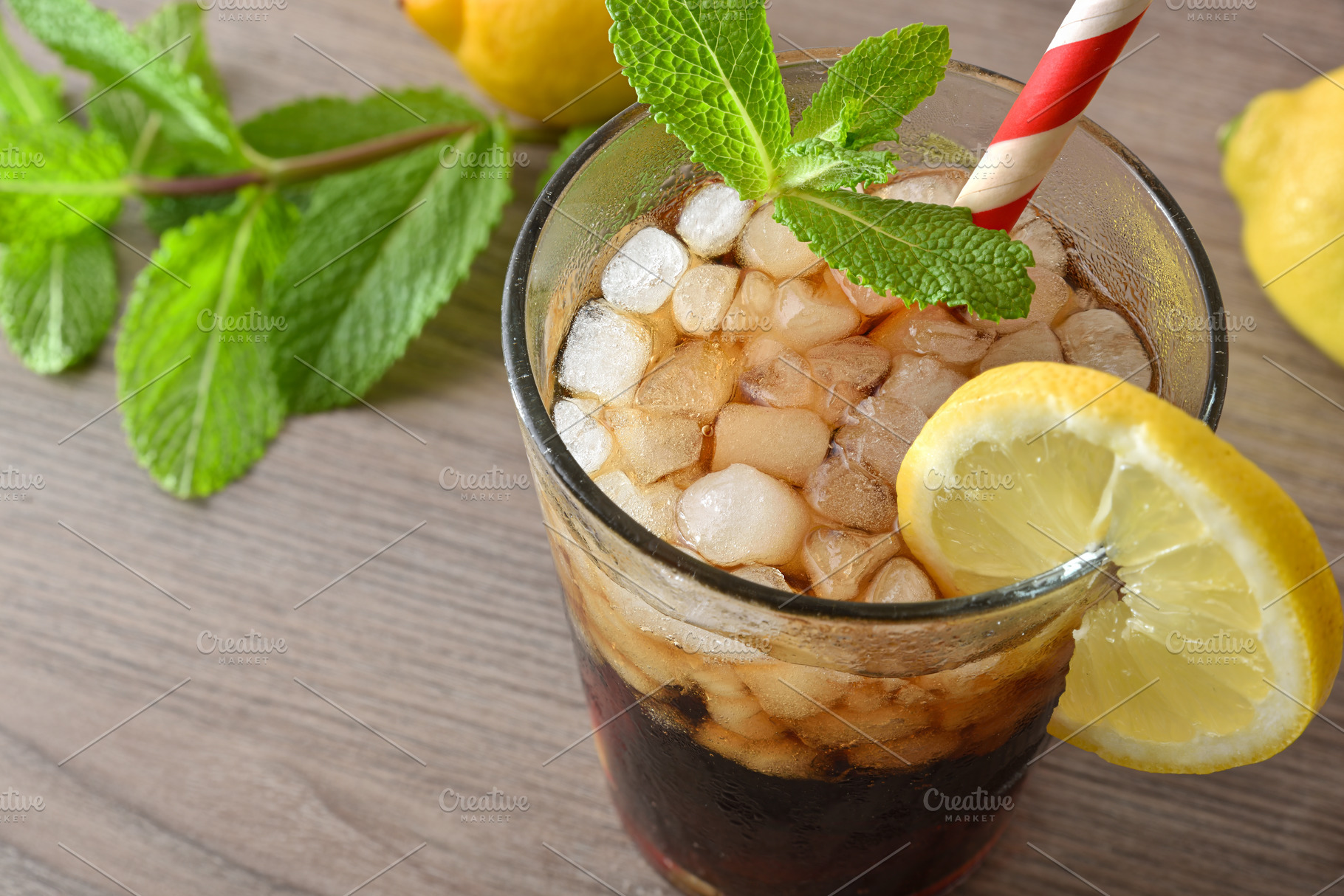 Refreshing cola drink with ice on white table elevated view, a Food & Drink Photo by Davizro's Market
