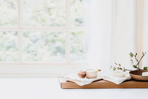 Japandi style spa soap, candles and flowers on wooden tray by wi, a Photo by Dvoevnore photos