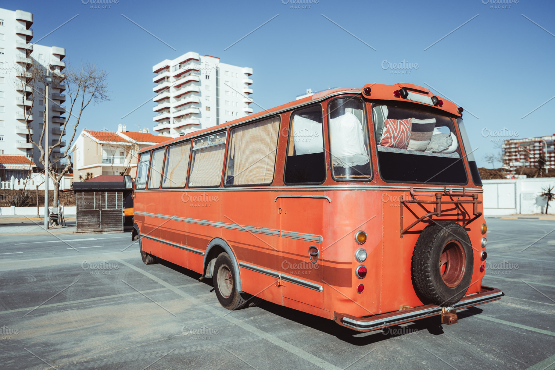 Retro camper bus in city setting, a Transportation Photo by SkyNext