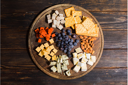 Top view of a delicious snack spread, a Food & Drink Photo by oksix