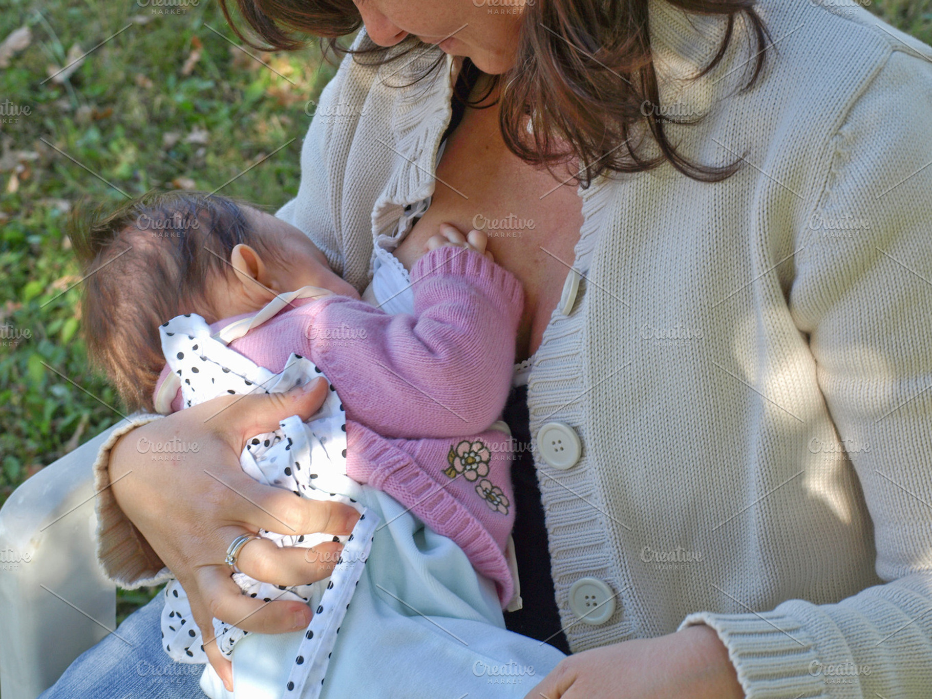 Woman breastfeeding featuring woman, girl, and breastfeed