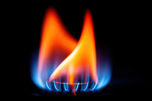 Colorful flames dancing against a dark background in a close-up view of fire, an Arts & Entertainment Photo by AlyaAnd