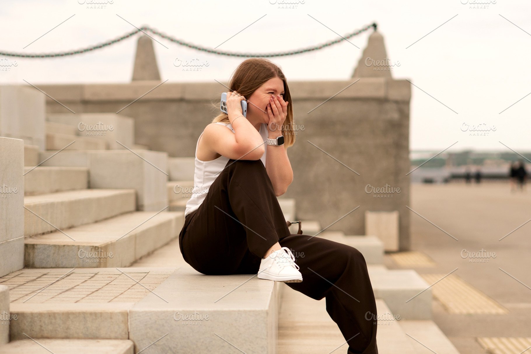 Young woman sitting on stone steps, a Person Photo by Elena Vagengeim