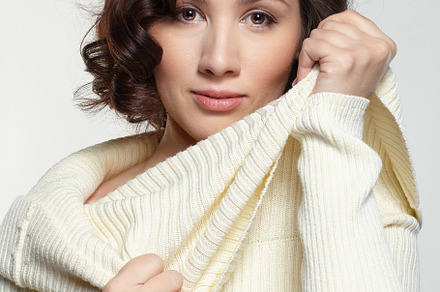 Brunette beautiful woman dressed in large white woolen sweater o, a Person Photo by Zastavkin