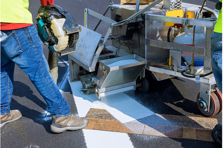 Workers apply a road marking to the, an Industrial Photo by Ungvar Studio