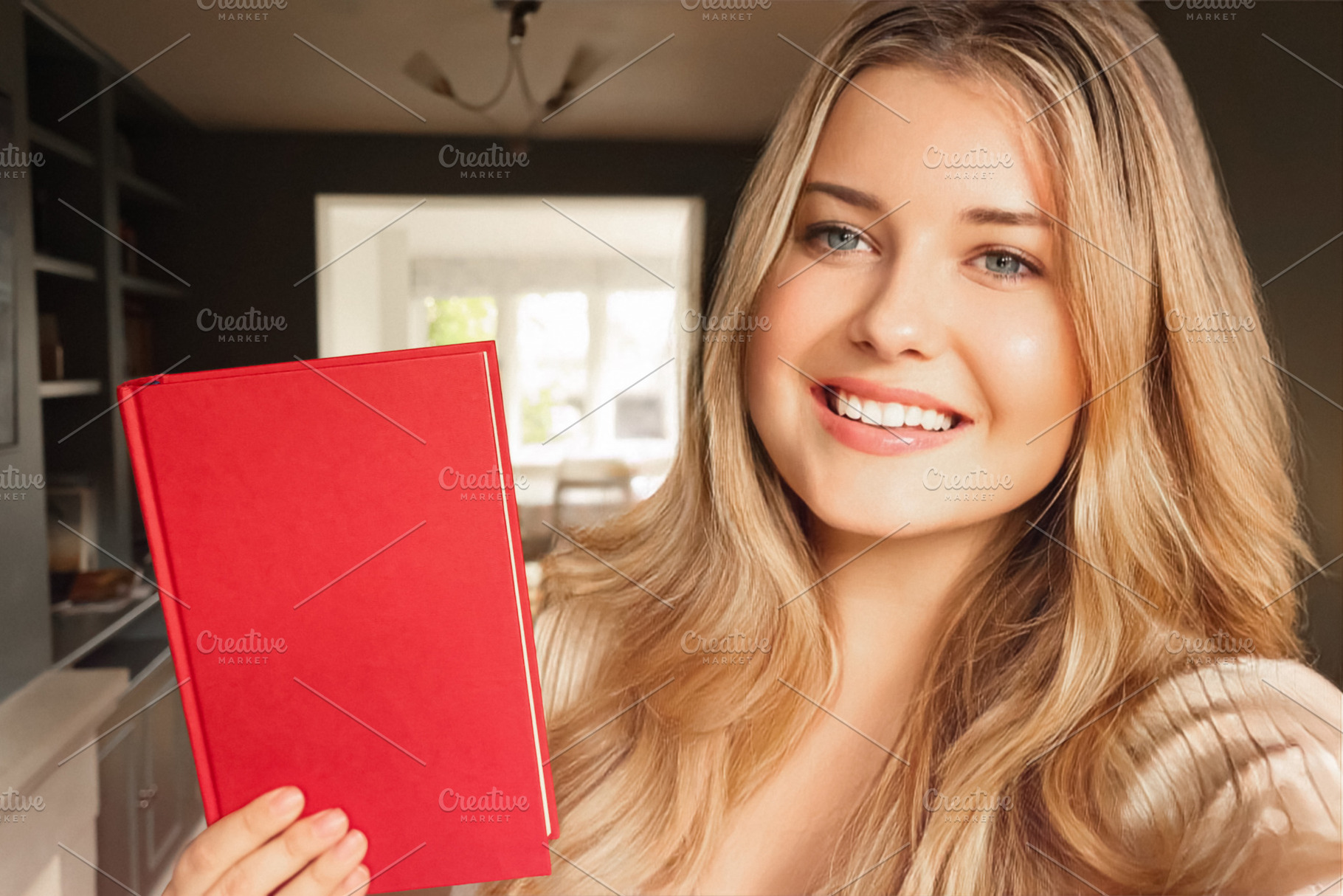 Happy blonde woman smiling at camera, holding blank red book for, a Person Photo by Studio ANNA