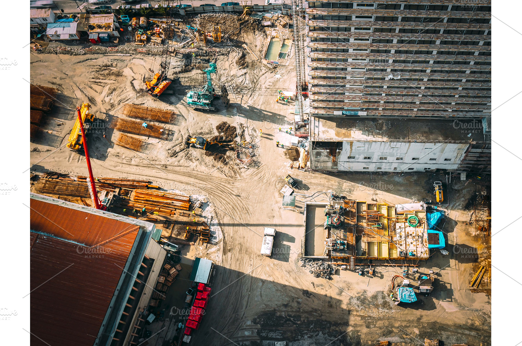 Construction cranes and excavators, an Industrial Photo by Our Amazing World