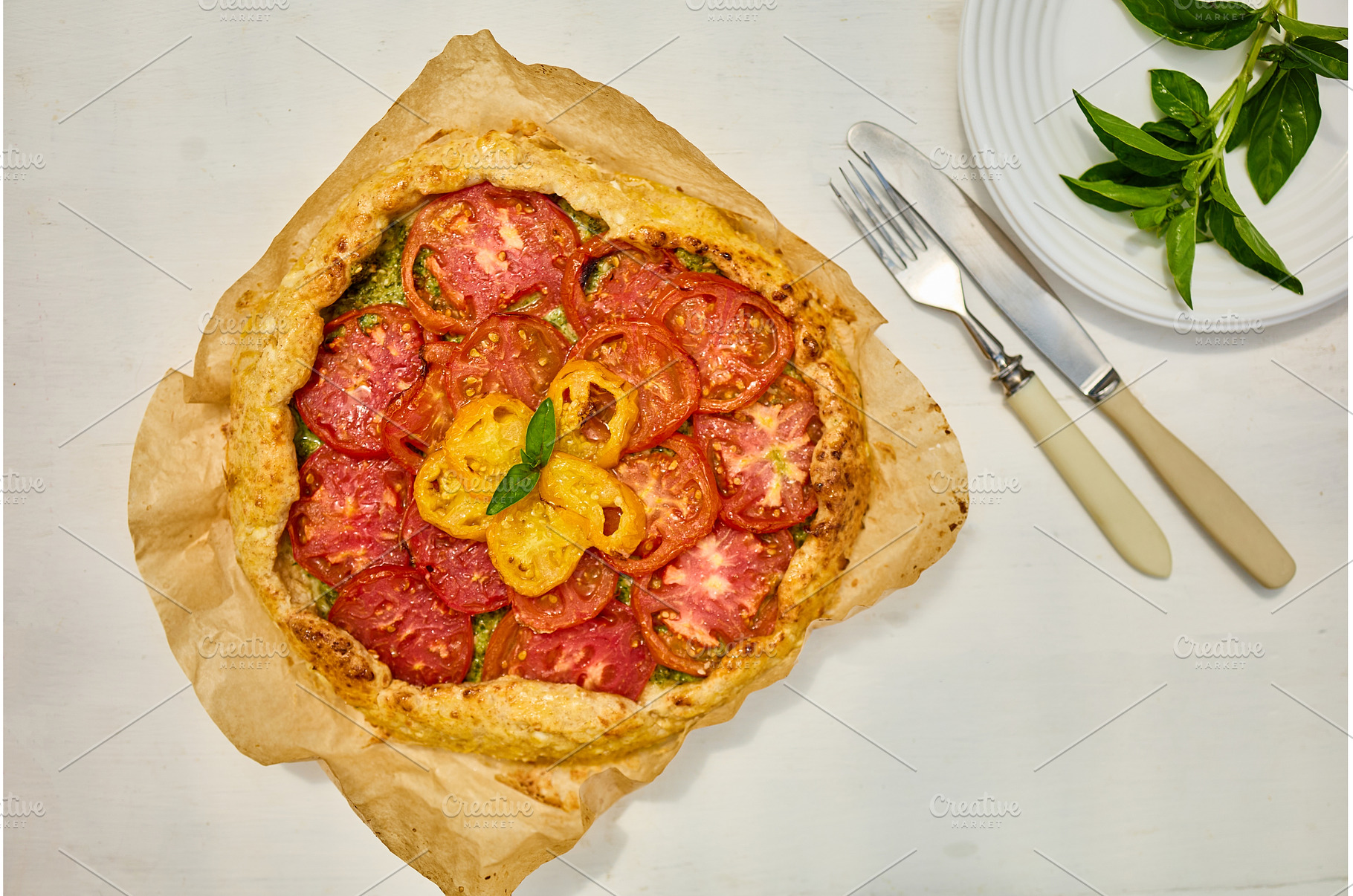 Freshly baked tomato galette on, a Food & Drink Photo by IlliaBondarPhotography