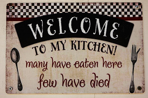 Humorous kitchen decor sign with playful text about food and safety, a Photo by AS photostudio